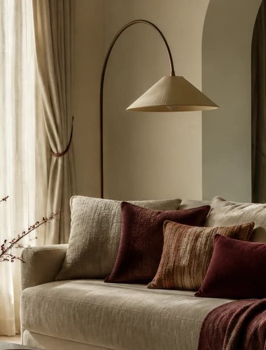 An arched floor lamp in warm light
